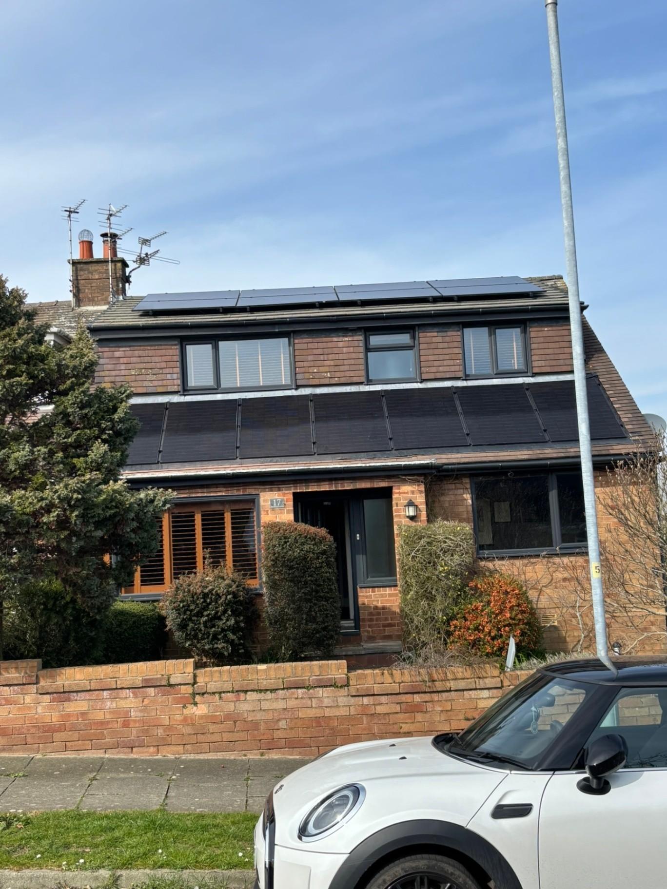 Domestic solar panel installation on a house roof