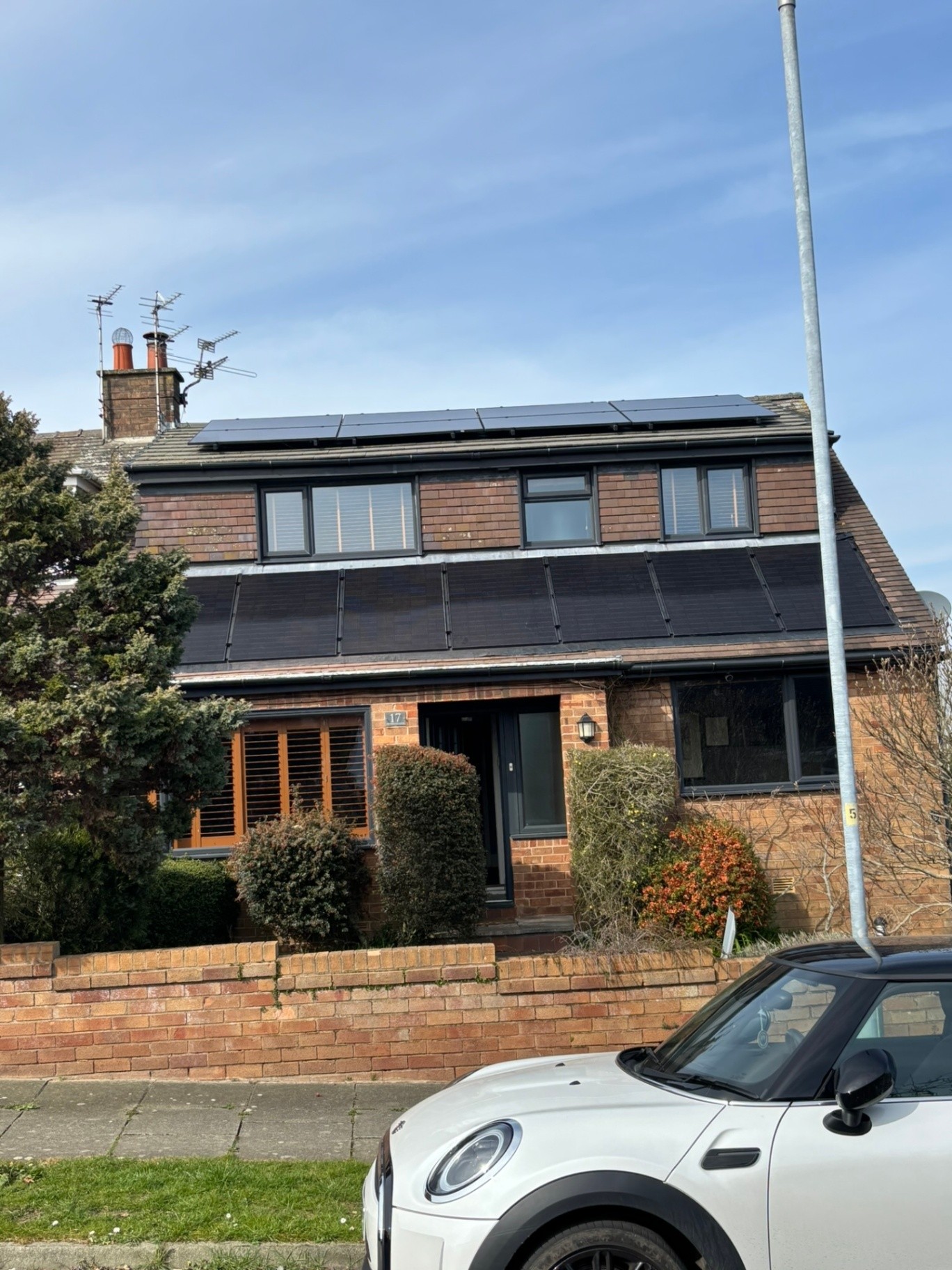 Domestic solar panel installation on a house roof
